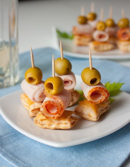 Canapés with olive and bacon
