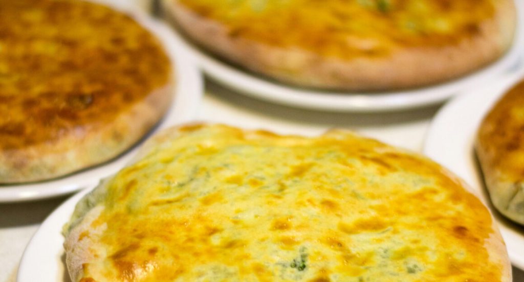 Megrelian khachapuri with melted cheese on top, baked at Limacat in Limassol