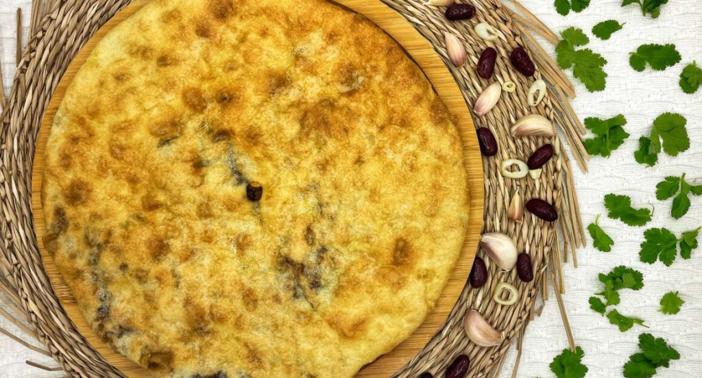Imeretian khachapuri golden round bread filled with cheese, Limacat delivery Limassol
